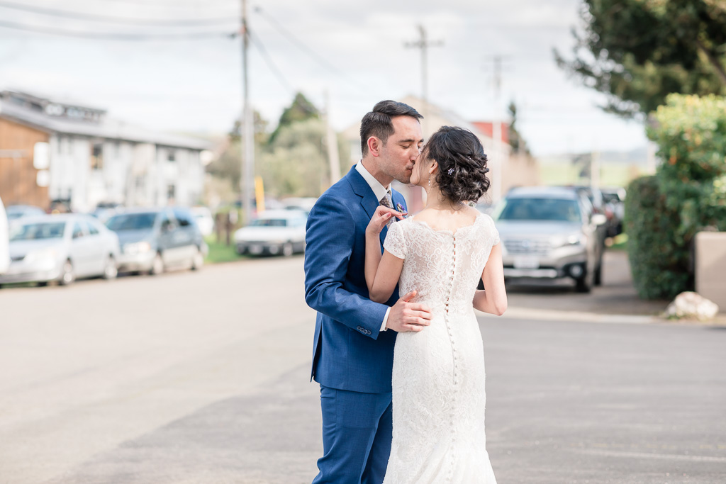a candid moment right after the wedding ceremony on the street of Point Reyes Station