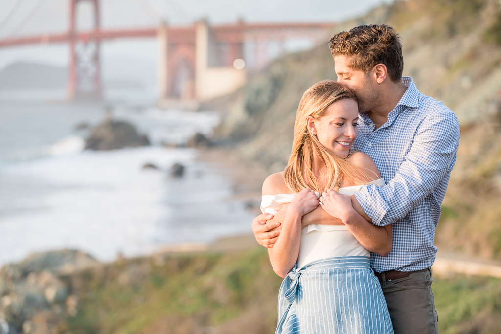 kissing on the head in front of Golden Gate Bridge