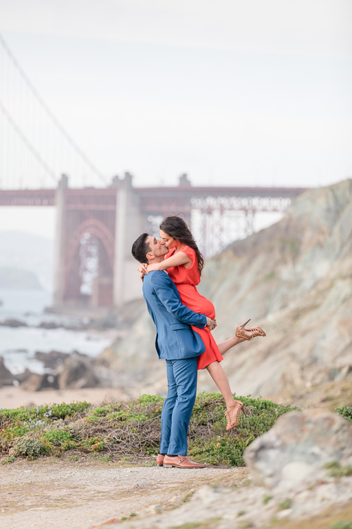 kiss on a lookout in front of the Golden Gate Bridge
