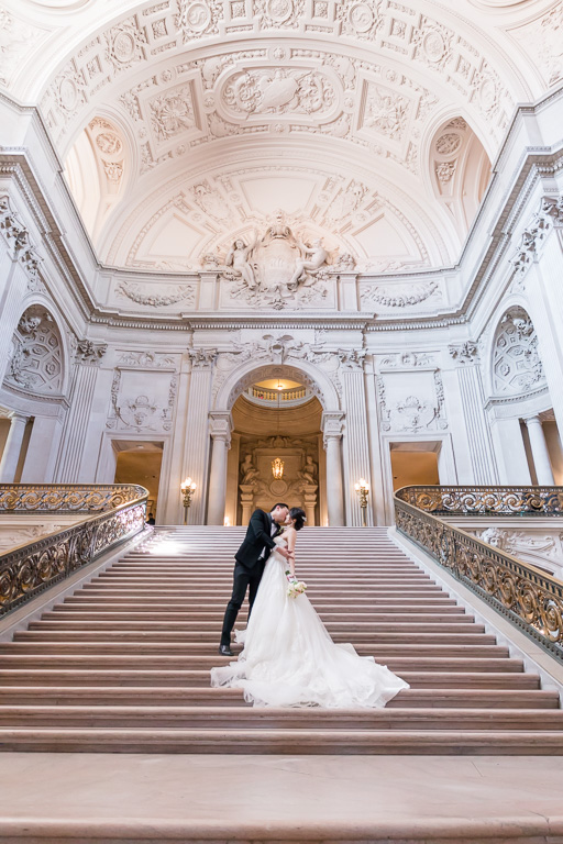 kissing on the grand staircase at San Francisco City Hall