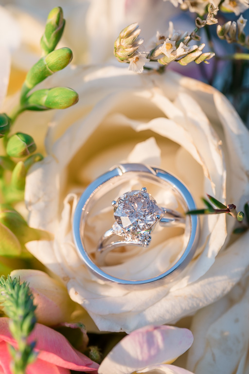 diamond engagement ring on wedding bouquet