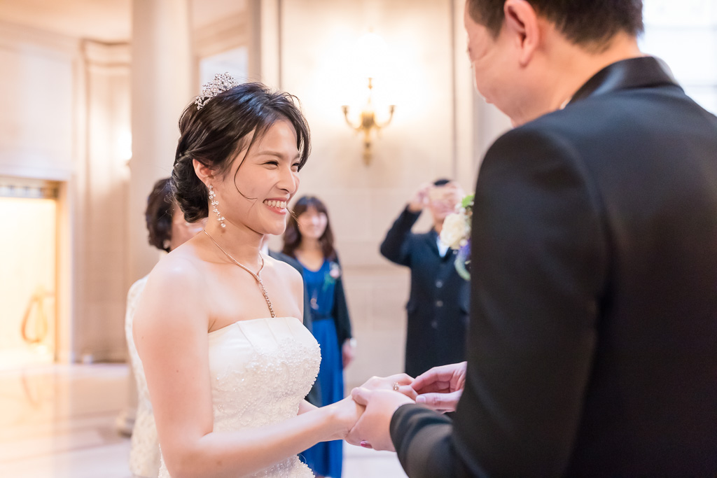 putting on wedding ring during ceremony