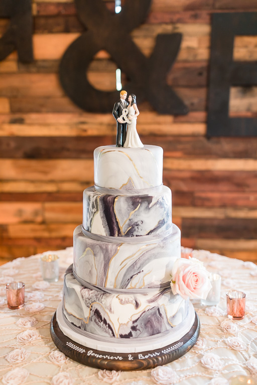 Elegant marble wedding cake on a customized cake stand