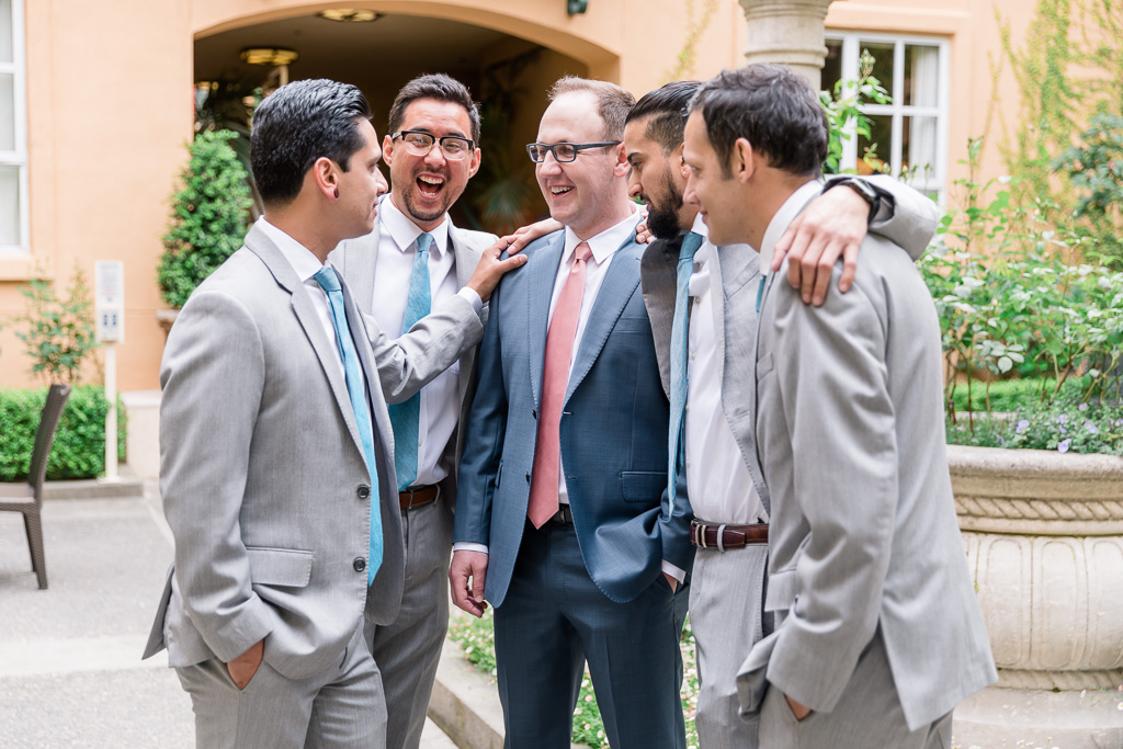 happy moment shared by the groom and his groomsmen