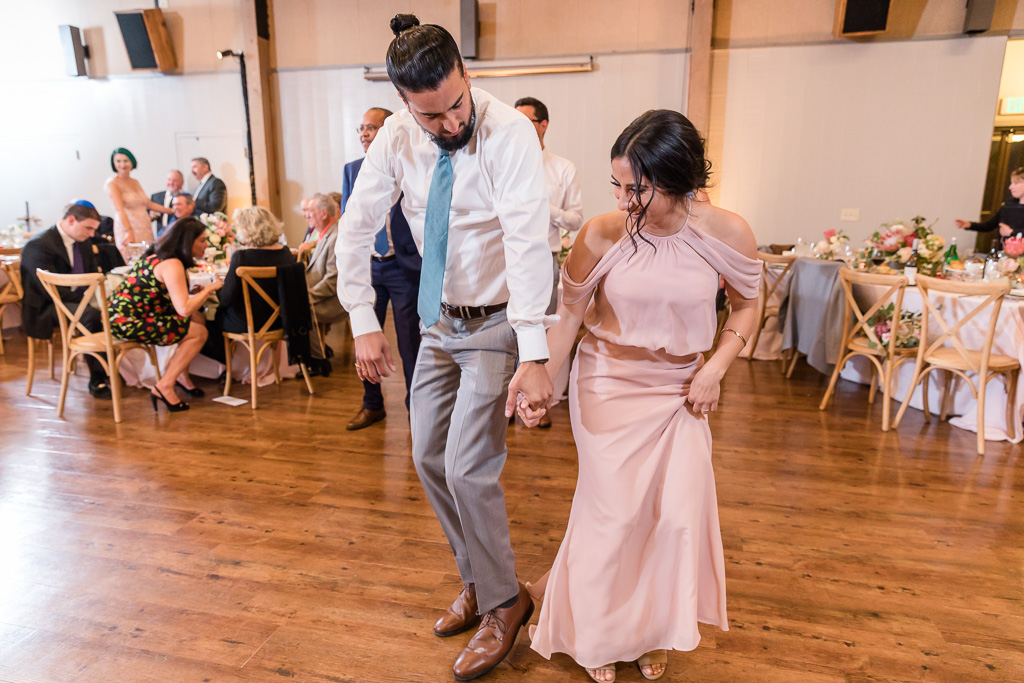 bridesmaid and groomsman owning the dance floor