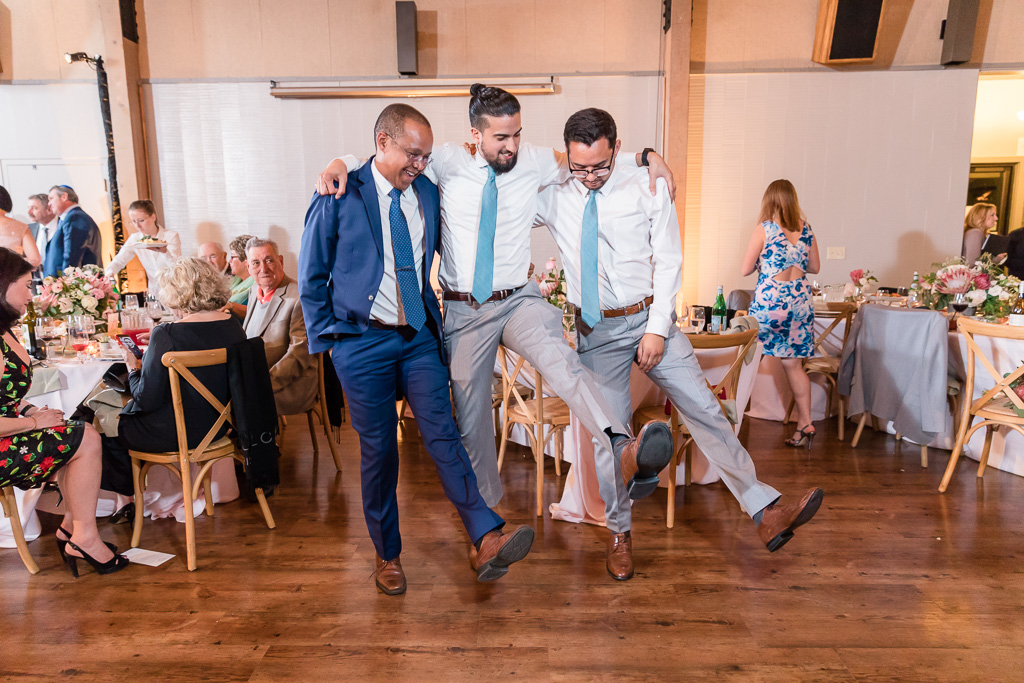 groomsmen being funny on the dance floor