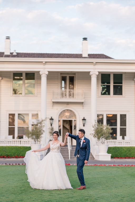 bride & groom wedding photograph in front of Silverado Resort mansion building