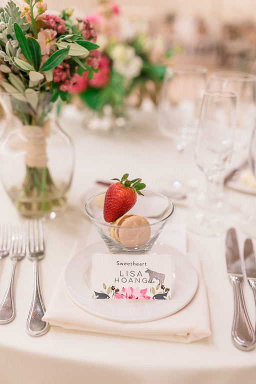 table setting with flowers, strawberry, and macaron for bride