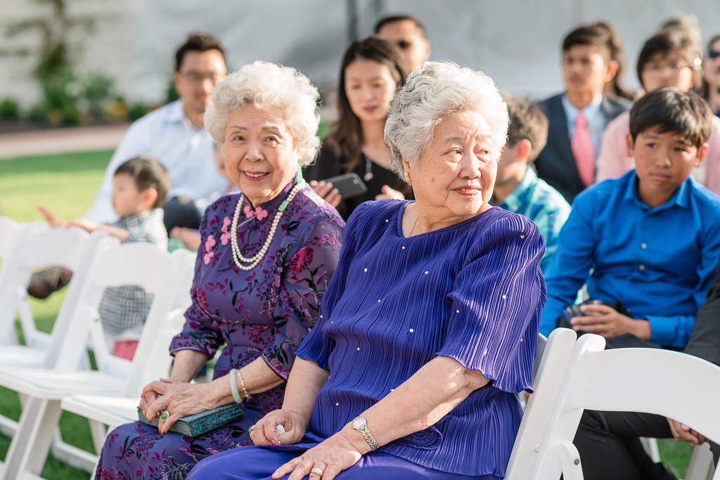two grandmas watching during wedding ceremony