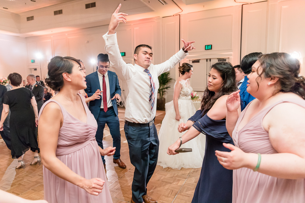 energetic guest at wedding on dance floor