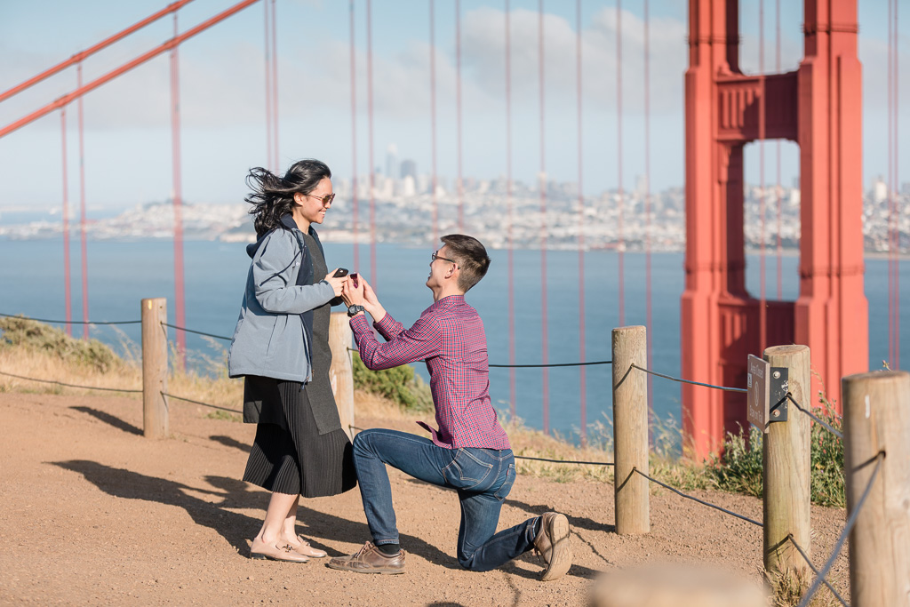 Surprise proposal in front of Golden Gate Bridge backdrop