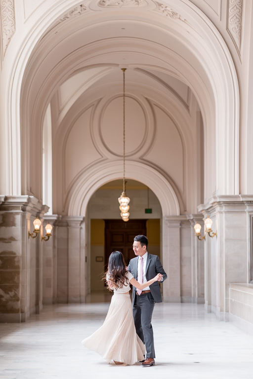 gorgeous couple dancing in the SF city hall hallway