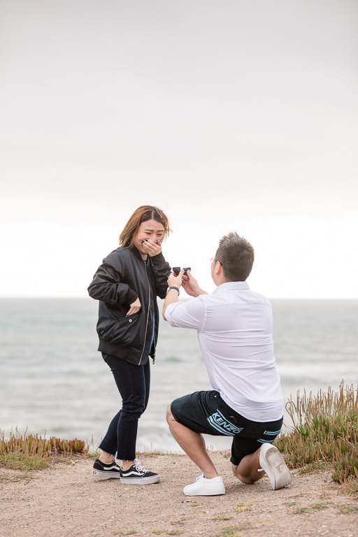 happy surprised reaction to surprise proposal