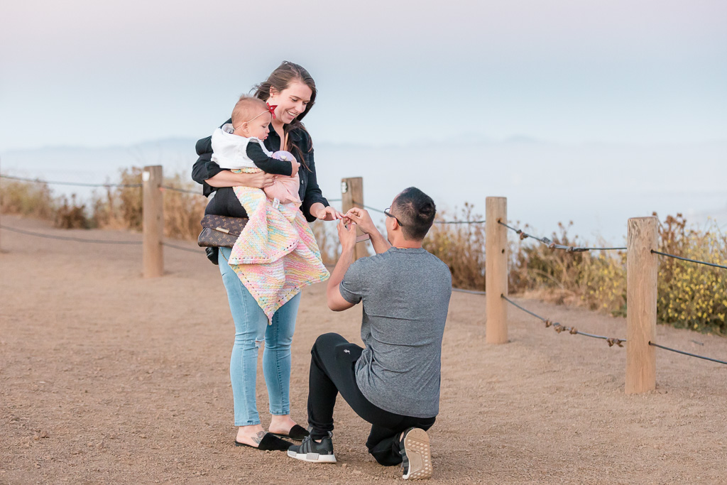 San Francisco surprise proposal with the most dreamy background - a foggy city view