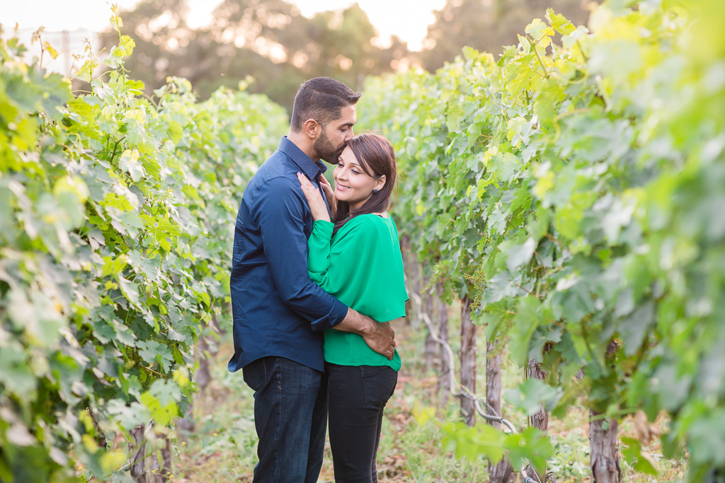 engagement couple portrait at calistoga ranch vineyard during sunset