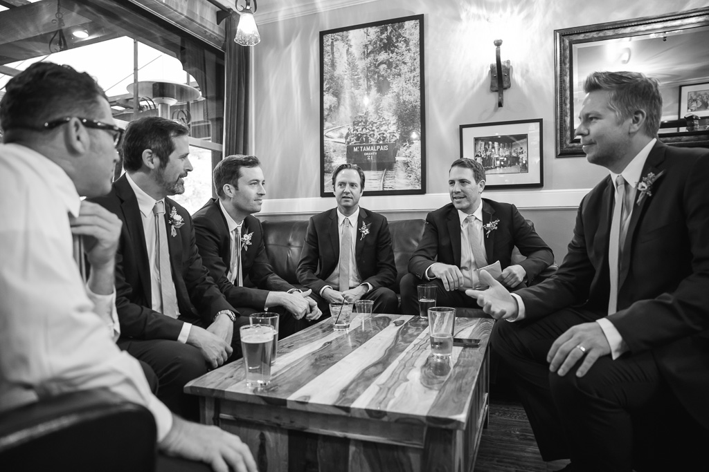 groom and groomsmen drinking at the bar