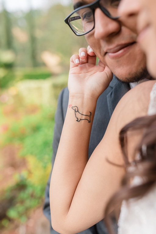 cute tattoo of a dachshund on bride's wrist