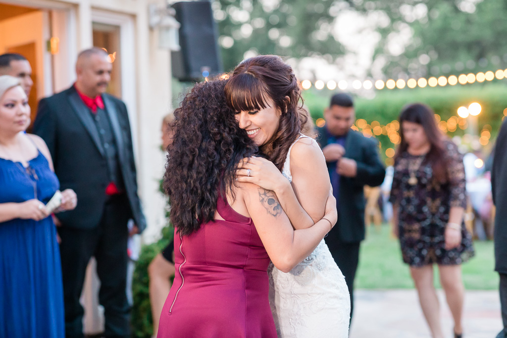 bride hugging a wedding guest