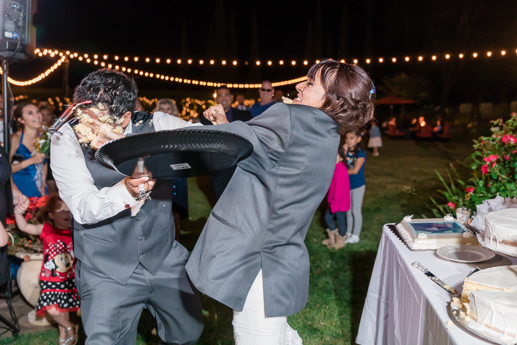 the most epic wedding cake smash ever, look at how the groom's glasses flew out of his face - Bay Area wedding phtoographer