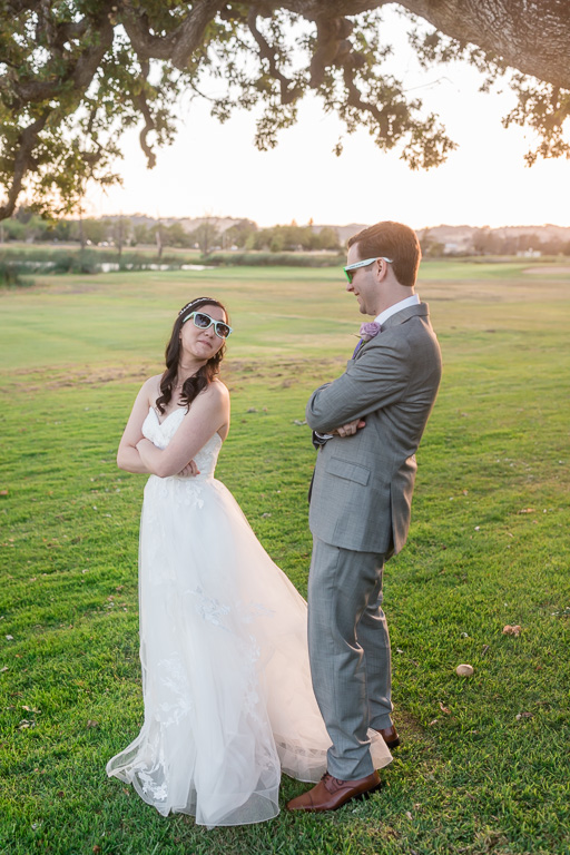 goofy bride and groom photo with their wedding sunglasses