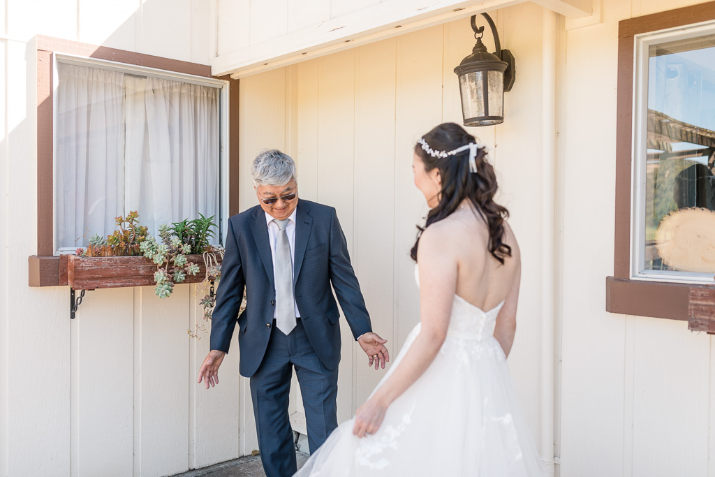 bride and father did a first look and dad's reaction was priceless