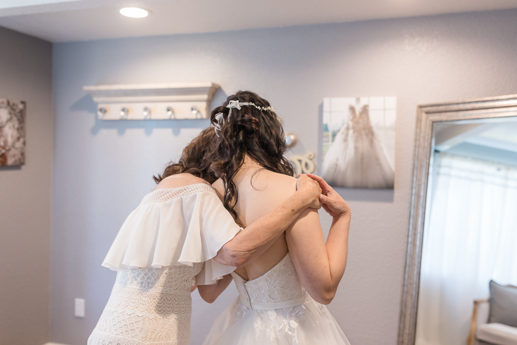 bride and mom sharing an emotional moment
