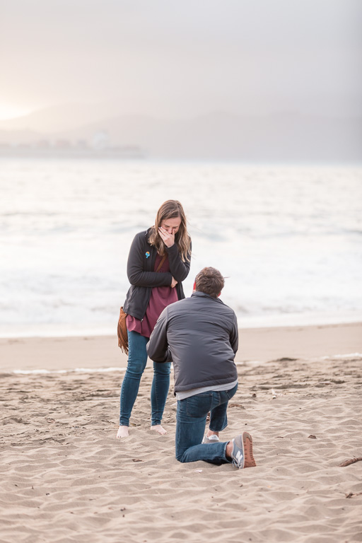 beach marriage proposal during sunset