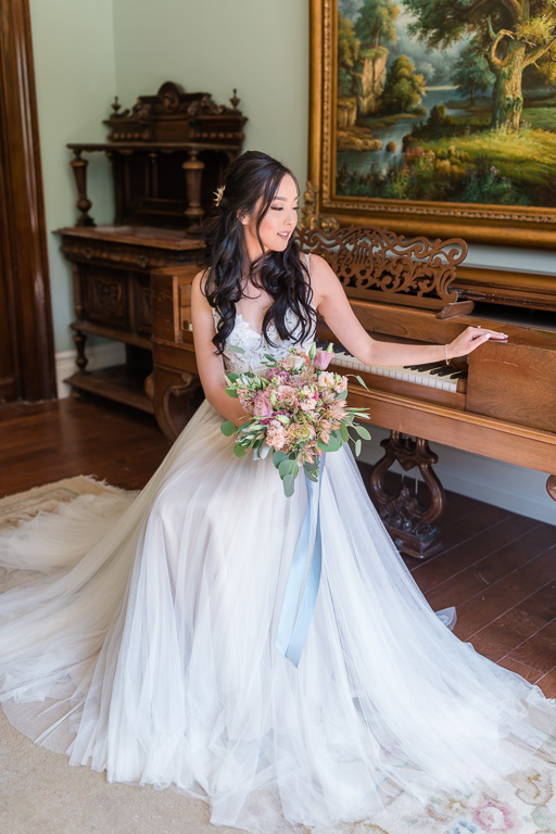 gorgeous bride by the vintage piano