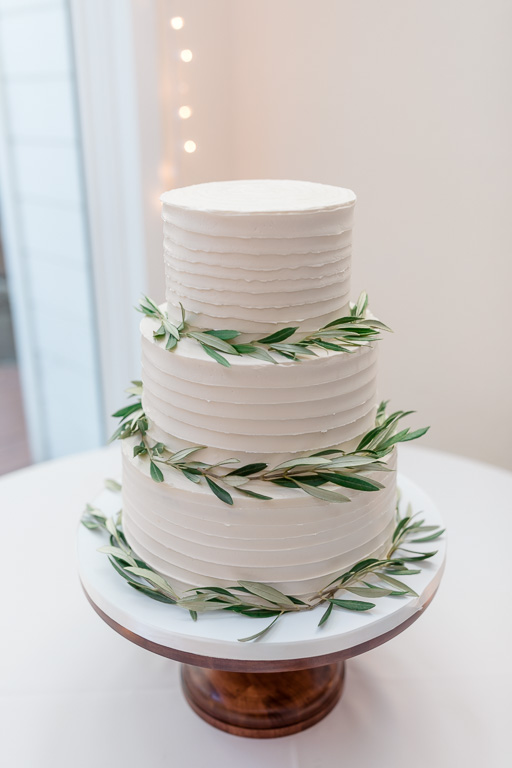 elegant wedding cake with green leaves