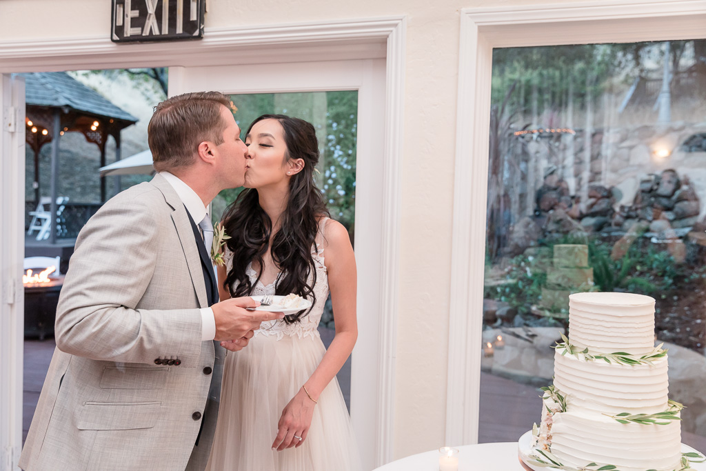 a kiss after feeding each other cake
