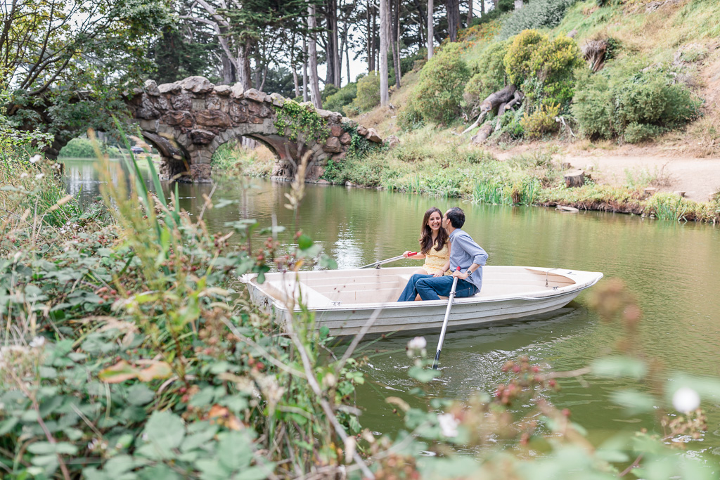 stow lake engagement photo in a row boat