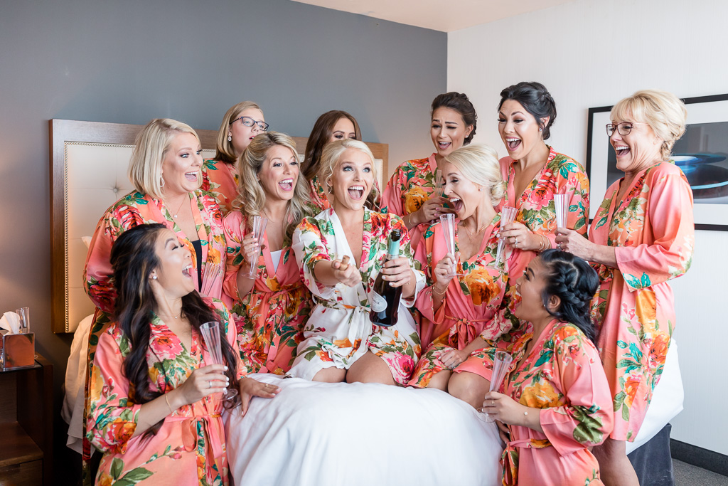 Hotel Murano wedding - girls opening the champagne
