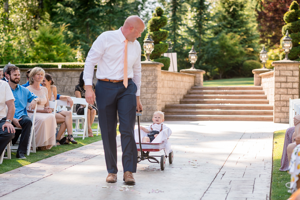 adorable baby ring bearer in his cute little carrier