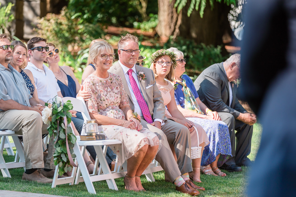 parents and guests' reaction during the lovely wedding ceremony in Puyallup garden