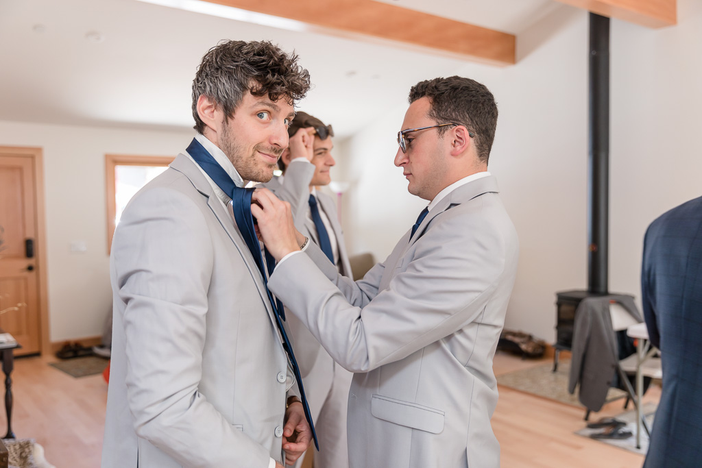 groomsmen fixing each other up