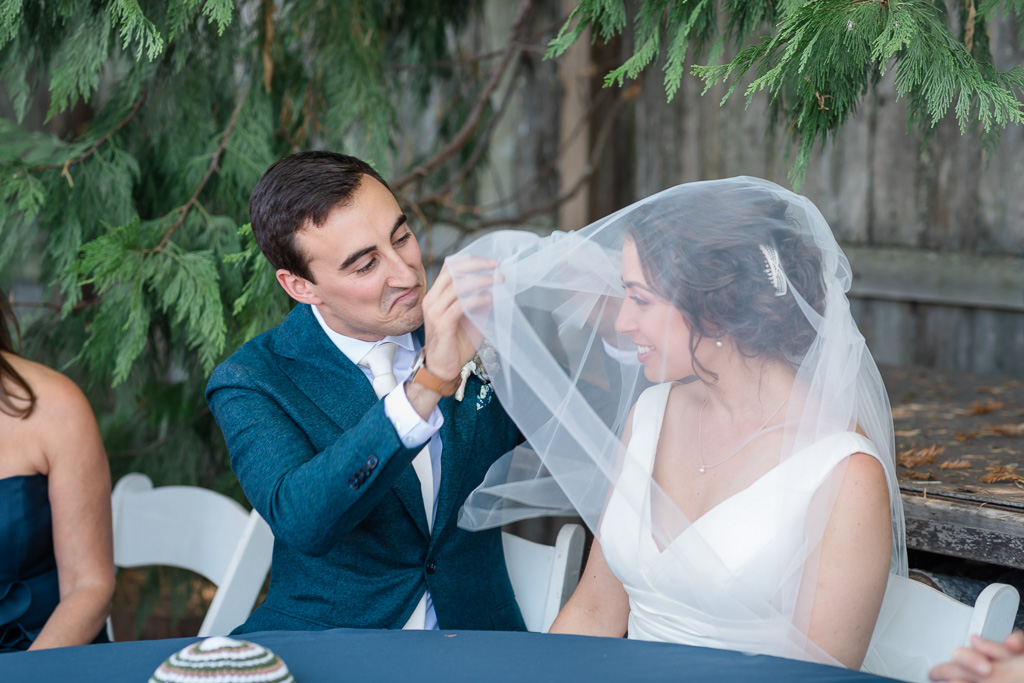 cute facial expression of the groom at the Jewish veiling ceremony