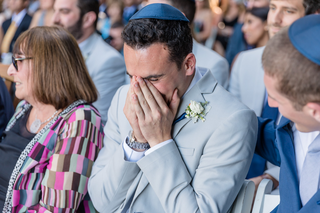 groom's brother getting very emotional during the wedding ceremony