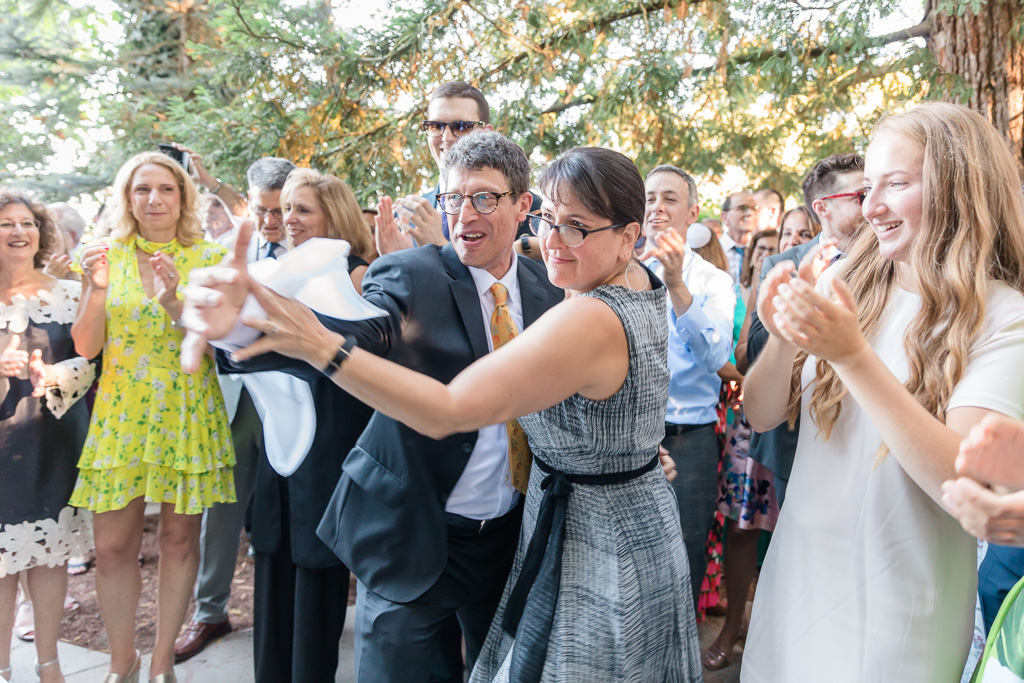 guests surprise the bride and groom with silly dances