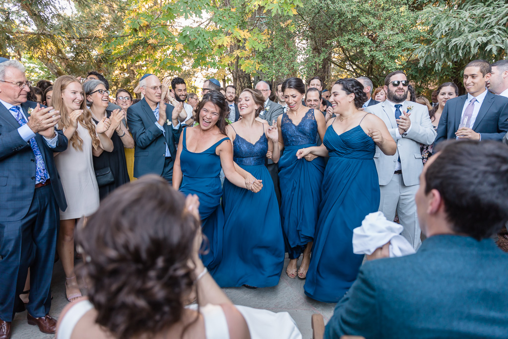 bridesmaids surprise the couple with silly dances