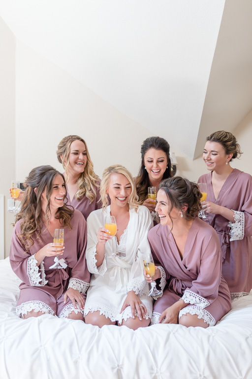cheers with the bridesmaids