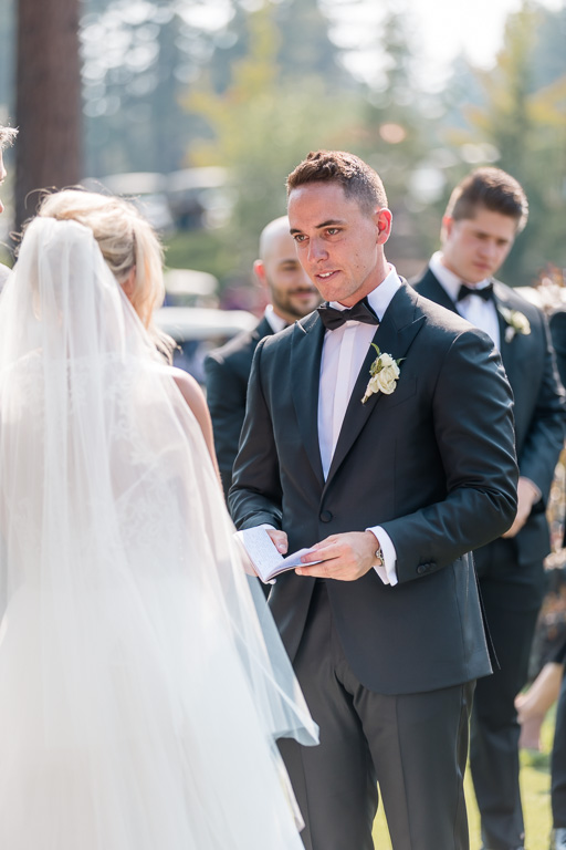 groom reads his sweet vows