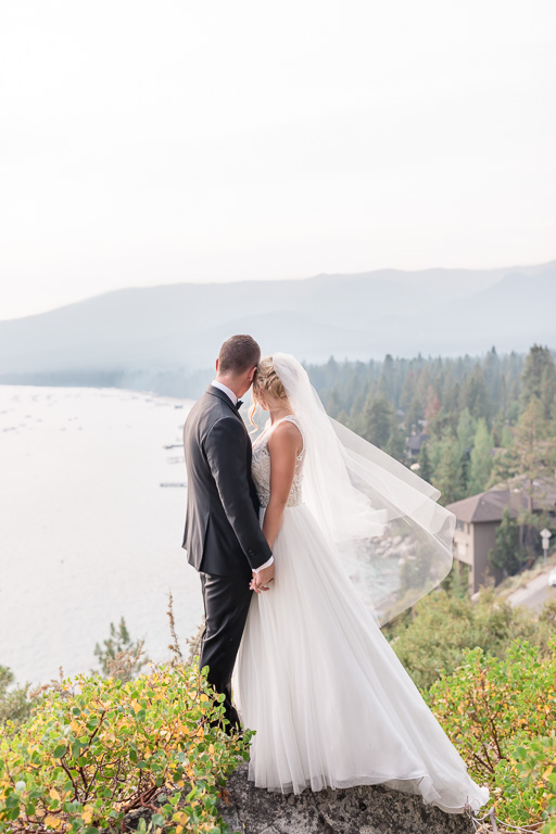 unique Lake Tahoe wedding photo up on a mountain overlooking the valley
