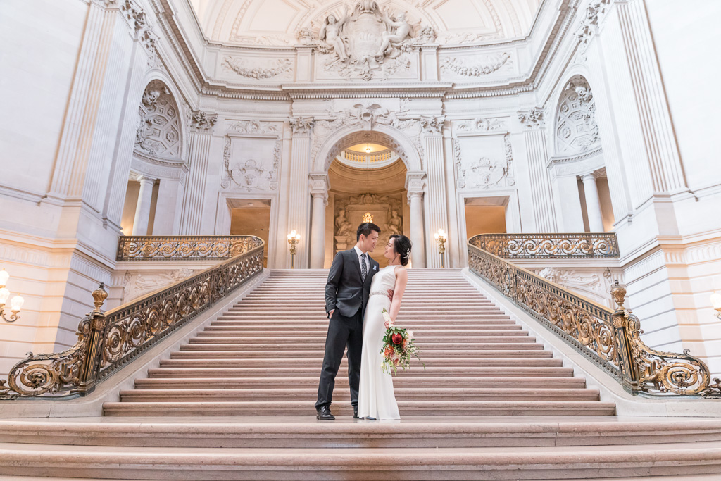 wedding photo on the big staircase at San Francisco city hall