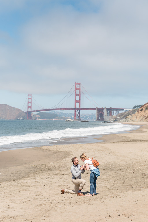 surprise engagement on Baker Beach in San Francisco