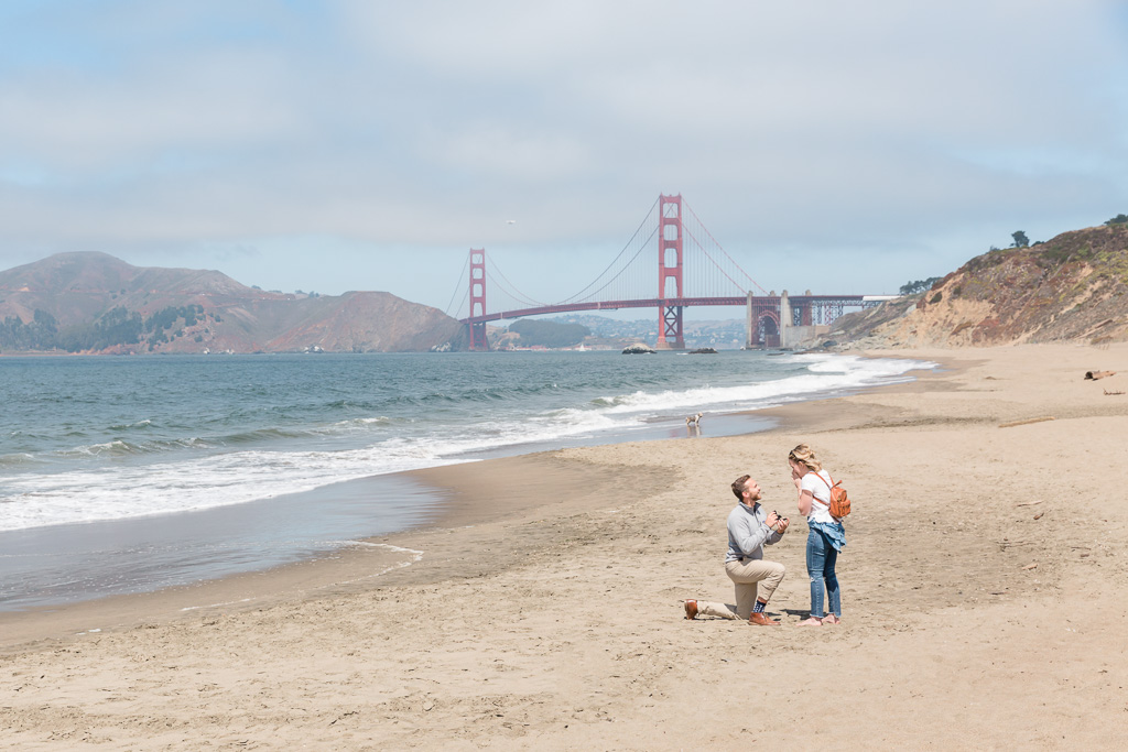 baker beach surprise marriage proposal with a stunning view of the golden gate bridge