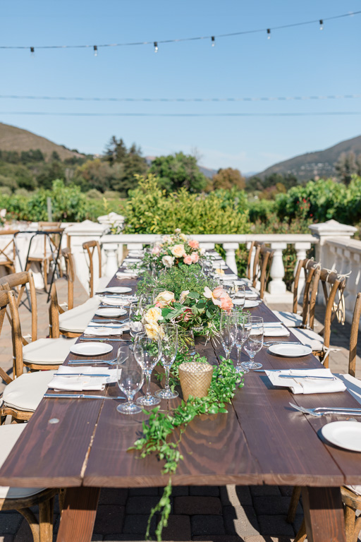 long farm table setup at Folktale winery for an outdoor reception