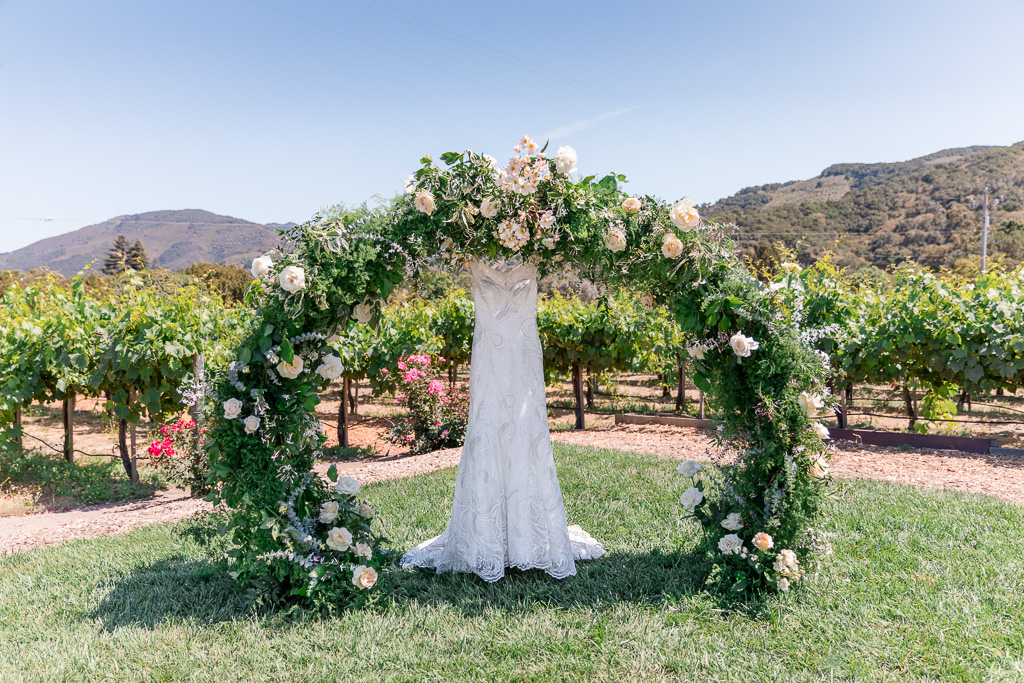 circle ceremony arch decorated with flowers
