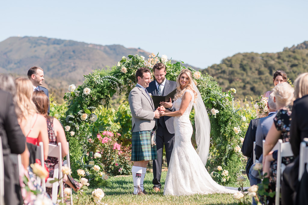 our happy couple during their vineyard wedding ceremony in Carmel