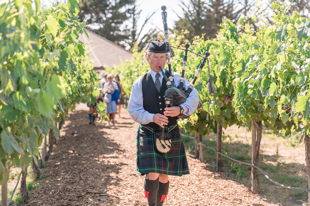 bagpiper leading the guests over to the reception area at Folktale