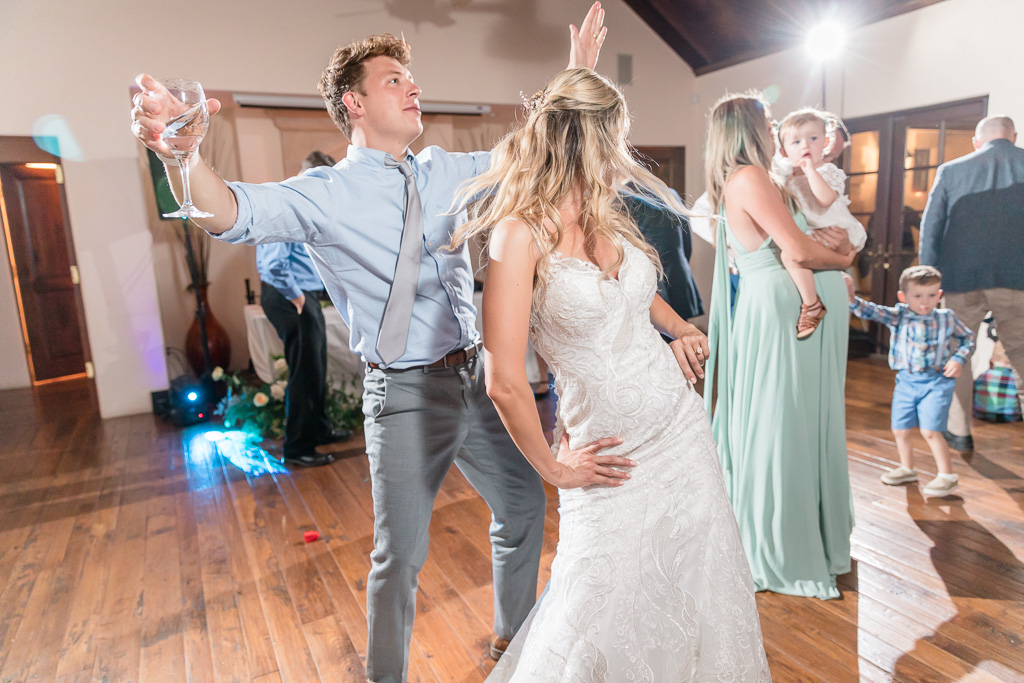 bride rocking her dress on the dance floor